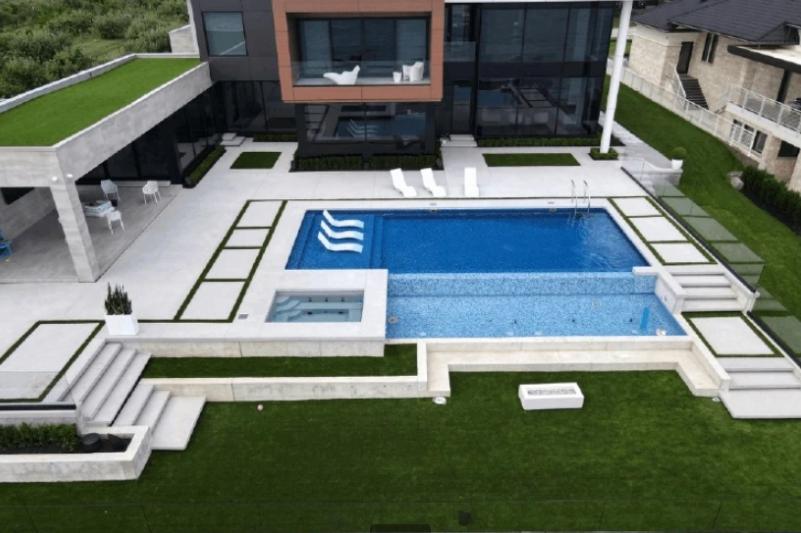 Swimming pool in the backyard of a house. 