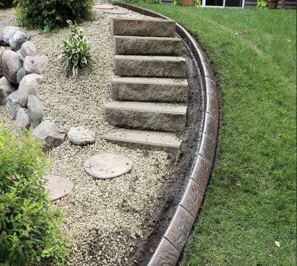 stones, stairs, and curbing in a backyard