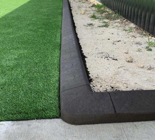 Artificial grass with curbing.  