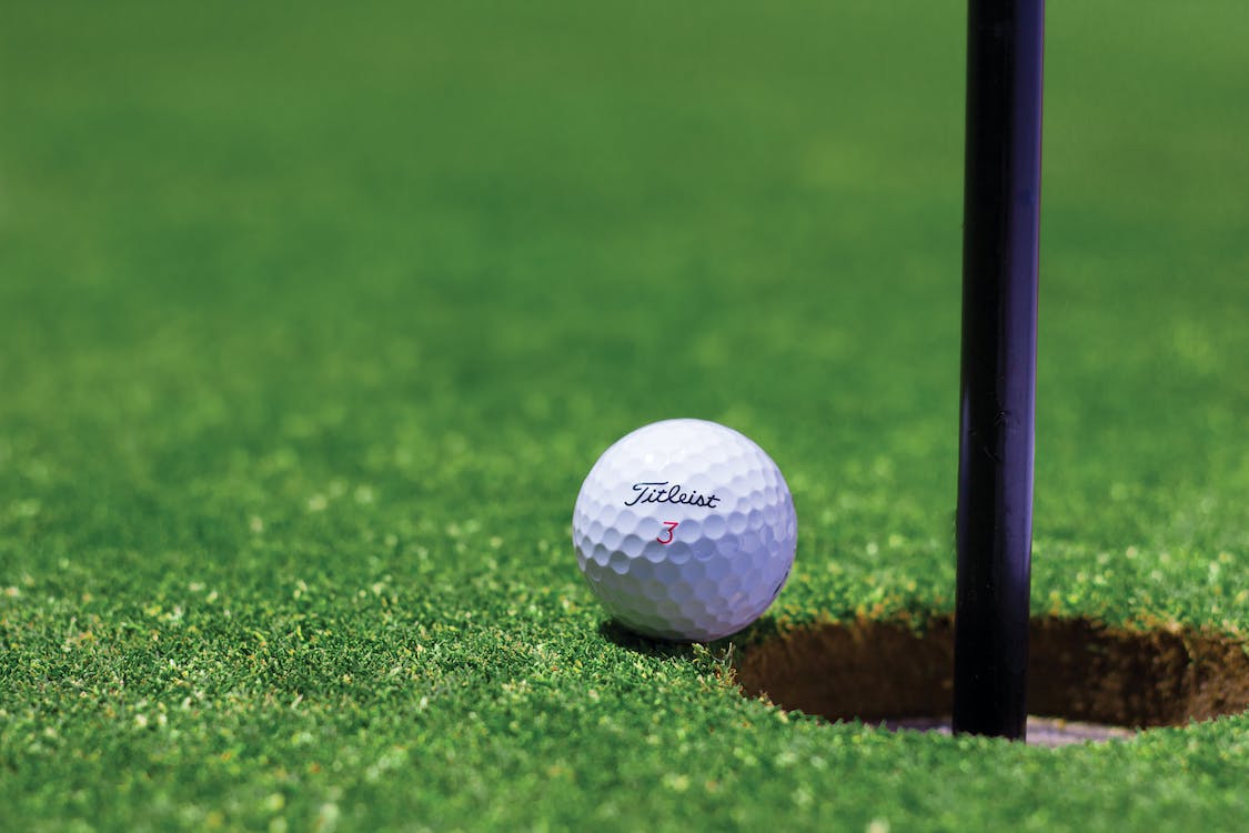 A golf ball on artificial grass