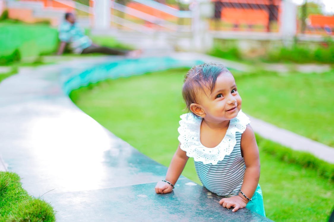 A child standing in a playground
