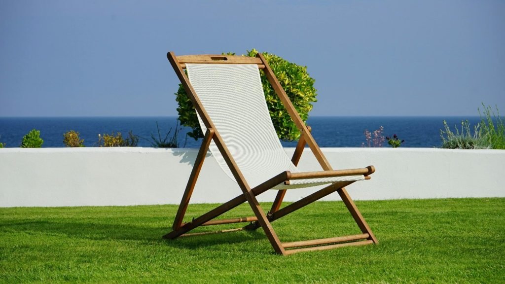 A lounge chair on artificial grass