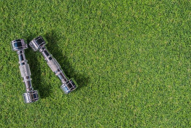 Weights sitting on grass