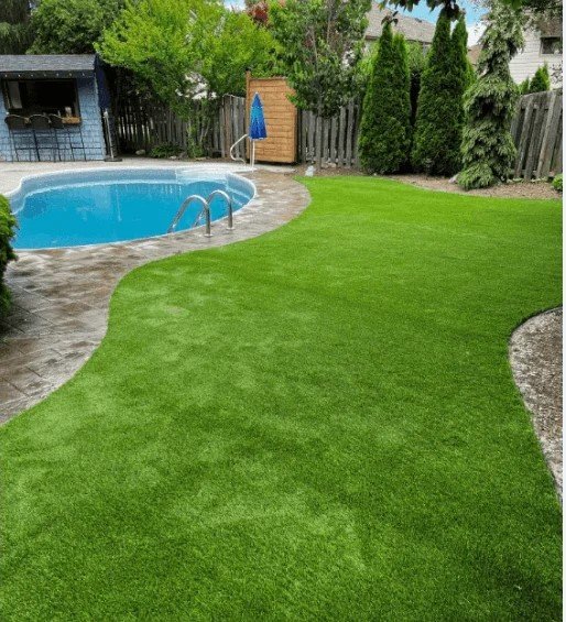 Artificial turf installed around a pool