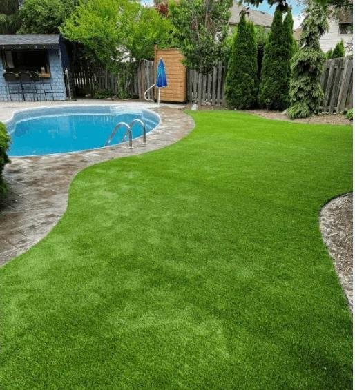 Artificial turf installed around a pool