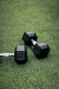 Dumbbells on artificial grass