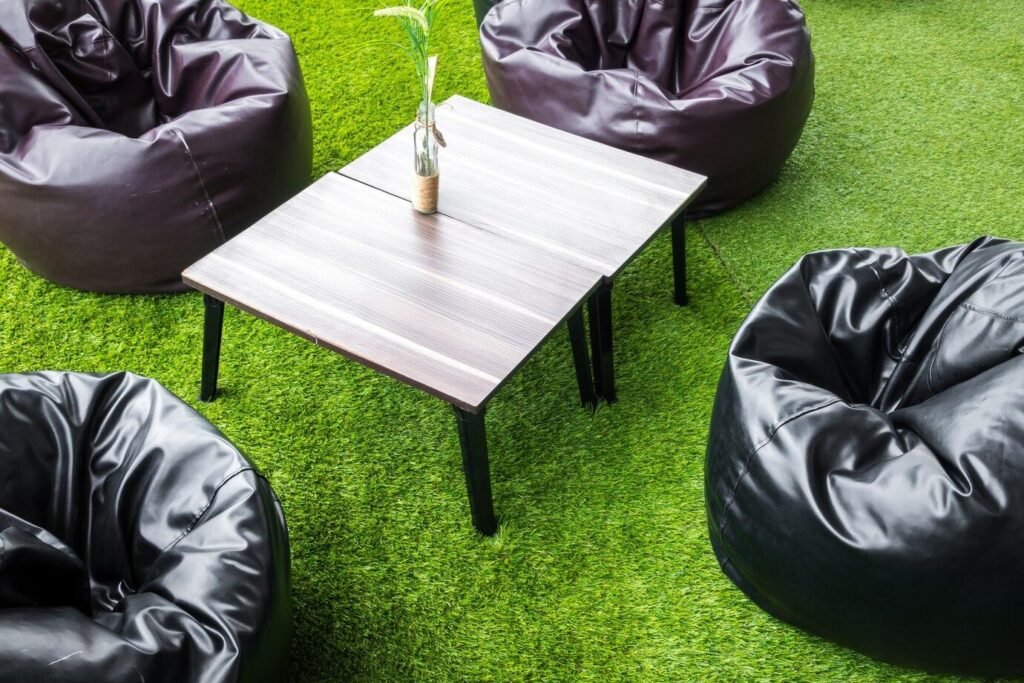 A table and chairs on turf