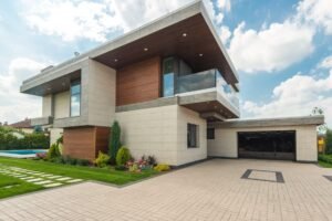 Brown and white house with landscaped front yard