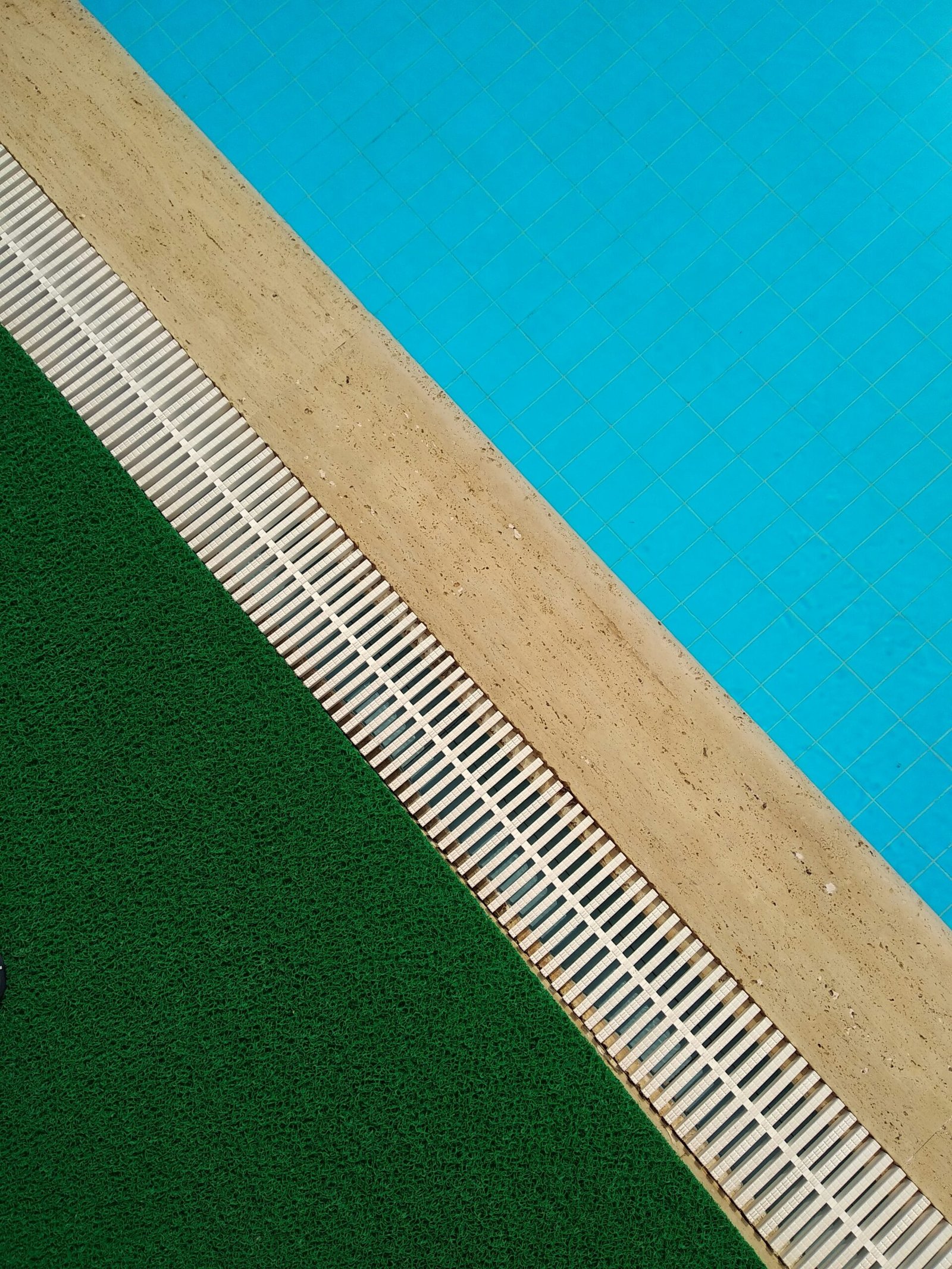Poolside next to artificial turf