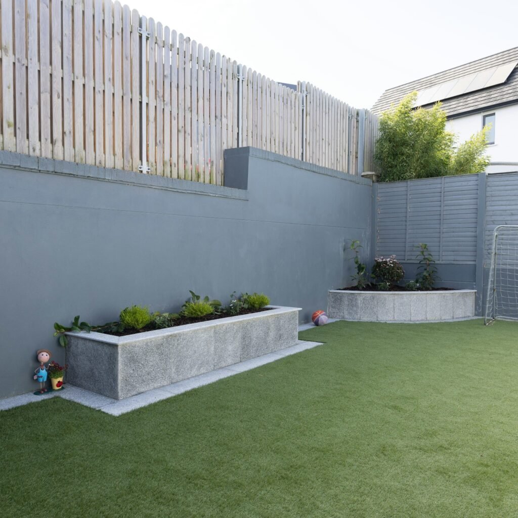 Small, minimalistic backyard with trimmed grass