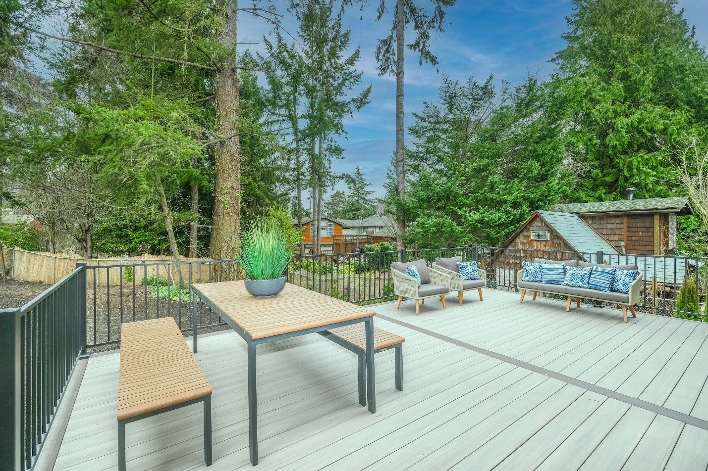 safe and simple family backyard design in Windsor with play and seating area
