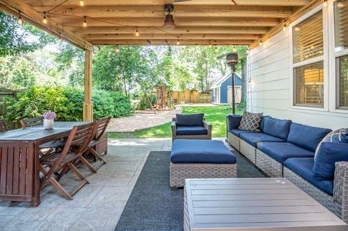 Cozy backyard seating area with outdoor furniture designed for relaxation.