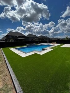 Artificial turf installation improving the outdoor area of a rental property in Windsor