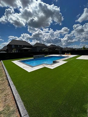 Artificial turf installation improving the outdoor area of a rental property in Windsor