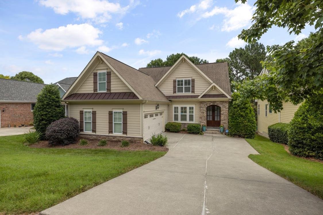 trees and grass outside a home