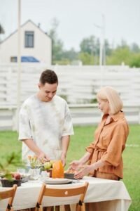 mother and her son preparing fruits in the yard