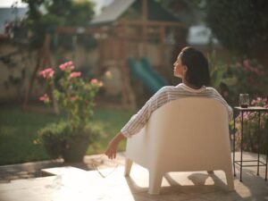 woman relaxing in a chair in her yard