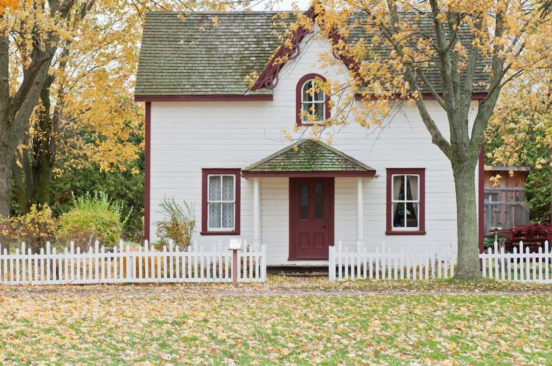 a home with a lawn covered with snow